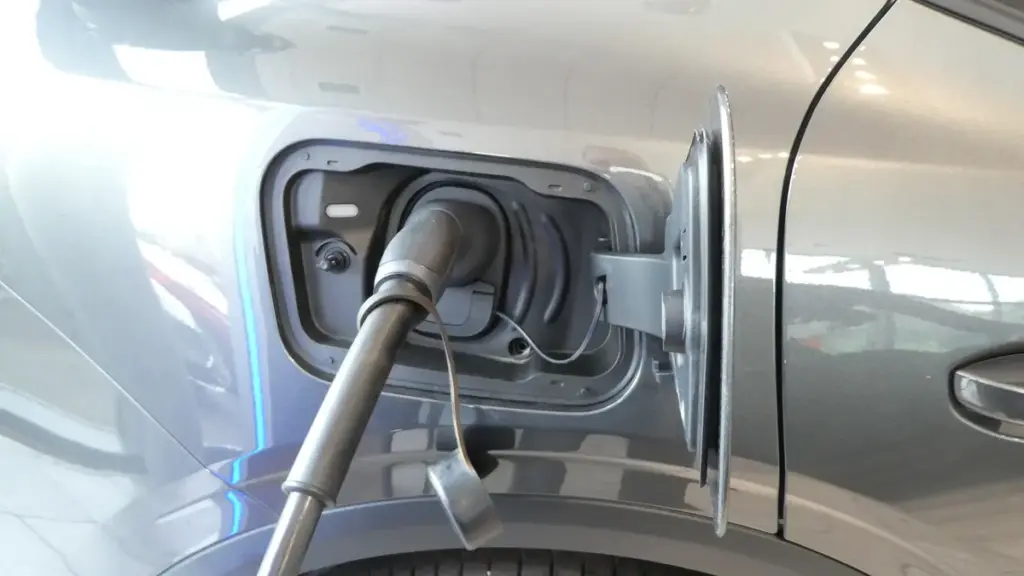 A Type 2 charging cable plugged into an electric car